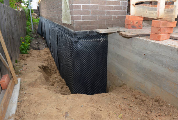 SJ Waterproofing Pros technician performing targeted Emergency Waterproofing assessment in Oxford, IN